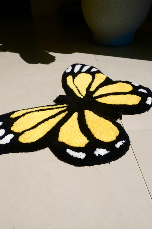 Tapis papillon jaune